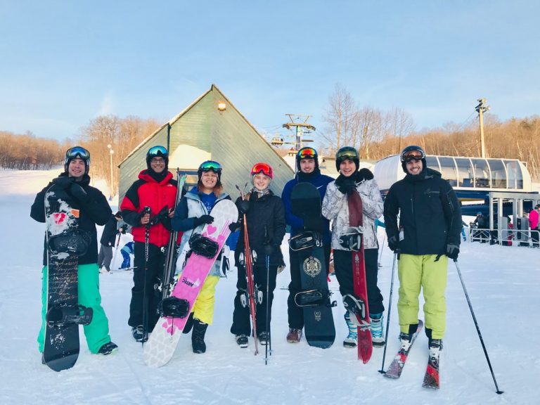 Seven employees at a ski day