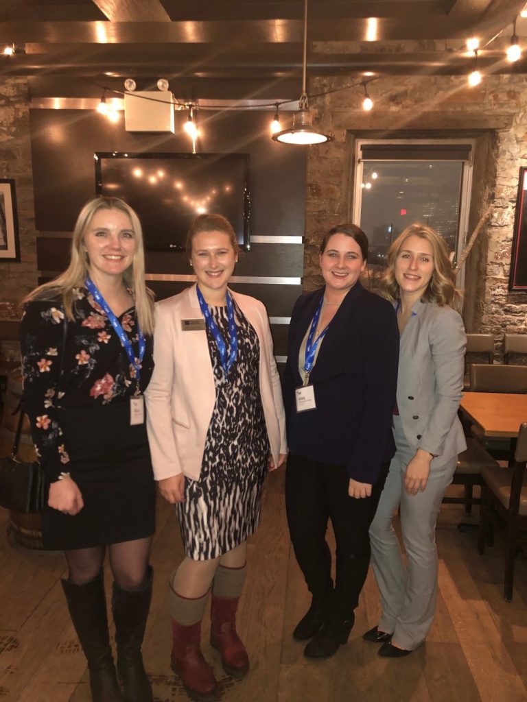 Four staff at a networking event