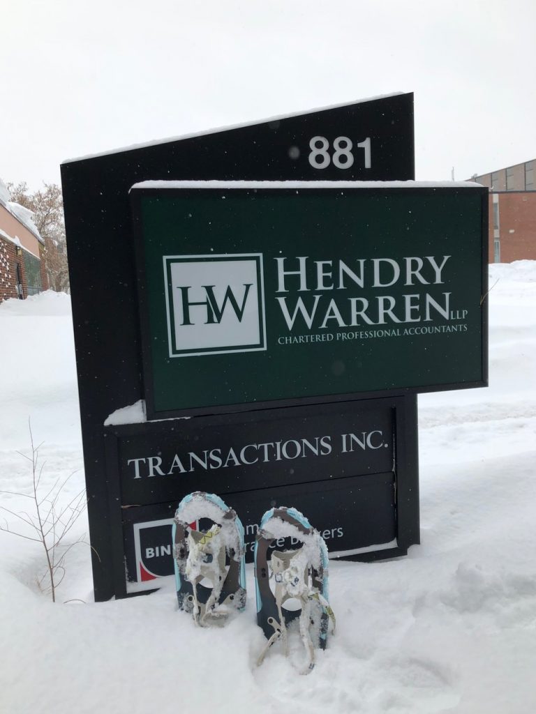 The Hendry Warren sign covered in snow