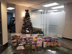 A Christmas tree with presents to be donated to Project Angel Tree in 2019
