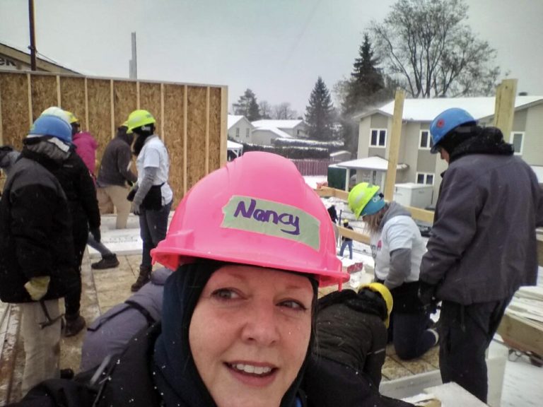 Employees volunteering on a construction site