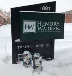 The Hendry Warren sign covered in snow